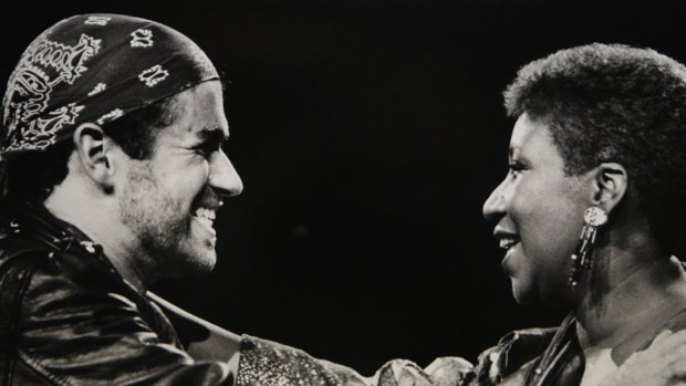 In this Aug. 30, 1988, photo, Aretha Franklin joined George Michael during his Faith World Tour in Michigan. 