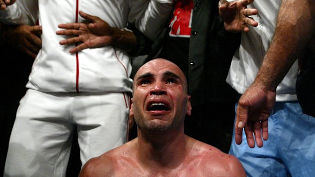 Raw emotion: Mundine breaks down after beating Antwun Echols to claim his first world title in 2003.