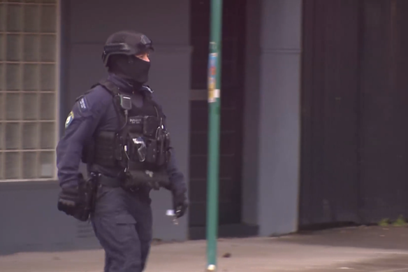 Tactical police, along with the police helicopter, are combing the suburb for the man. 