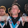 Zak Butters leads Port Adelaide off the ground after their stirring win over Geelong on Saturday.