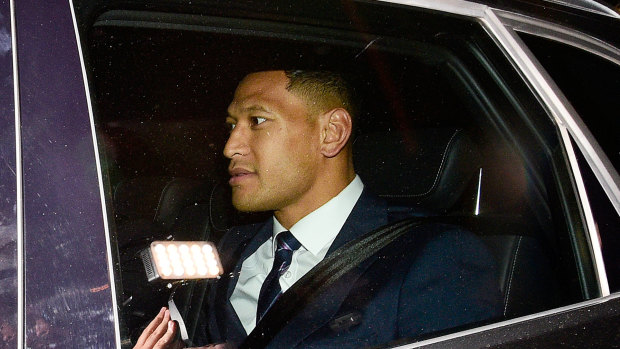 Israel Folau leaves a Rugby Australia code of conduct hearing in Sydney.