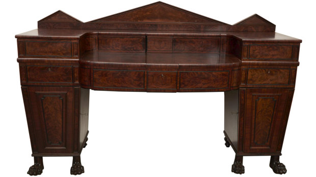 A Regency mahogany "plum pudding" sideboard, circa 1820, sold for $1200.
