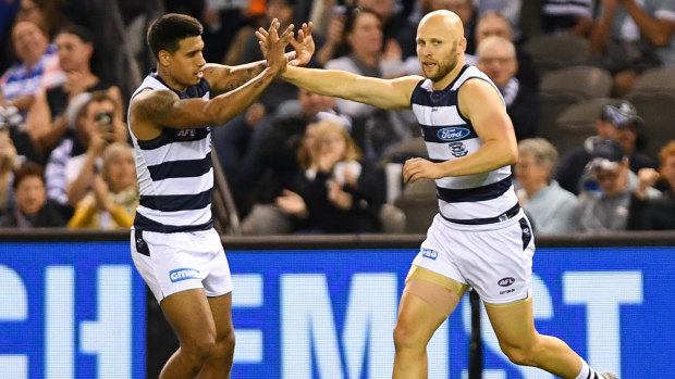 Rare breed: Cats Tim Kelly and Gary Ablett jnr celebrate a goal against the Roos.