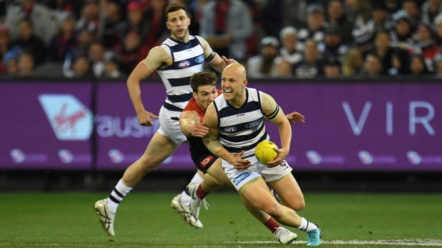 Jack Viney of the Demons (centre) and Gary Ablett of the Cats (right) contest at the MCG during the first elimination final. 