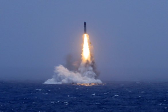 An image published by a Chinese state media outlet shows a missile being launched from a submarine in the South Pacific.