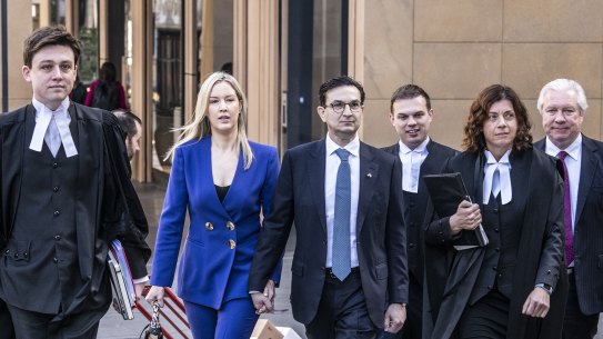 Surgeon Munjed Al Muderis, his partner Claudia Roberts and his legal team outside the Federal Court in Sydney on Monday.