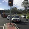 The crash scene at the intersection of Moggill Road and Margaret Court in Kenmore.