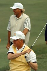 Bill Clinton and Greg Norman play golf together in Australia.