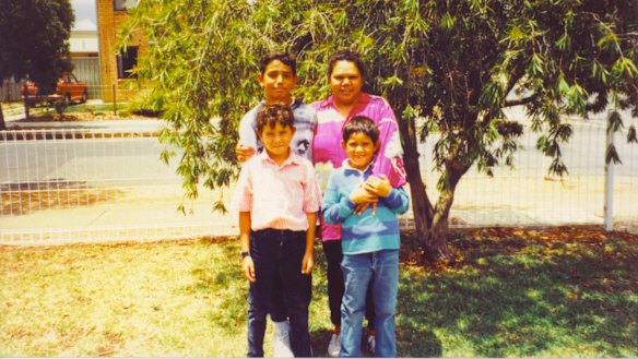 Adam (rear), with brothers Jake and Brett and mother Lisa May. 