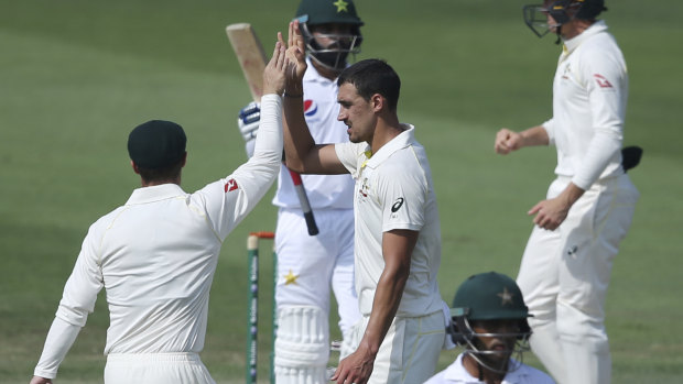 Early breakthrough: Australia celebrate the dismissal of Pakistan's Muhammad Hafeez from the bowling of Mitchell Starc.