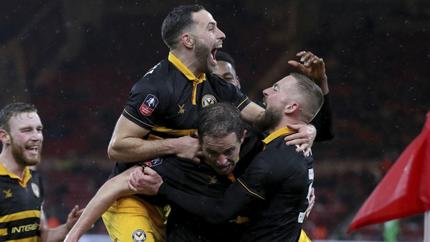 Jubilation: Newport County players celebrate after Matthew Dolan scored the second goal of their 2-0 win over Middlesbrough.