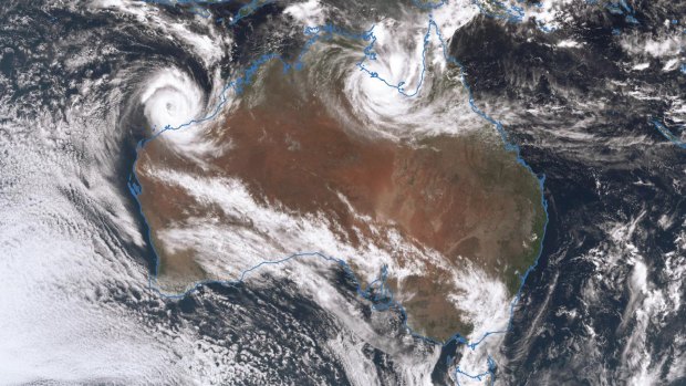 A satellite image shows twin Cyclone systems in the Australian top end, as at 1pm Saturday. Cyclone Veronica (left) and Cyclone Trevor (right). 