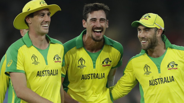 Australia's Mitchell Starc, centre, celebrates after Australia defeated New Zealand by 86 runs.