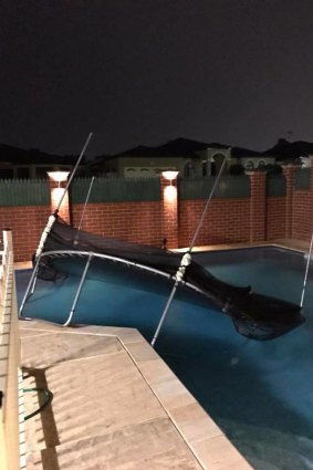 A trampoline landed in a backyard pool in Alexander Heights.
