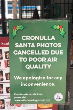 A sign apologising for Santa's absence at Cronulla Mall, with Scott Morrison's office in the background.