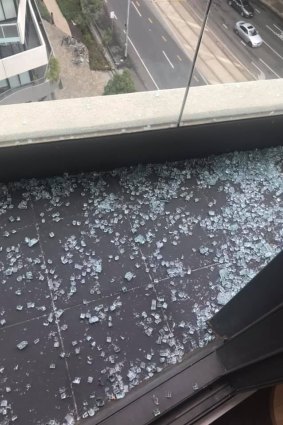 Glass fell onto the balcony of the apartment below. 