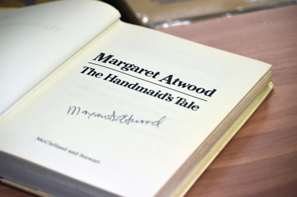 A signed first edition of The Handmaid’s Tale by Margaret Atwood is for sale at the UQ Rare Book Auction.