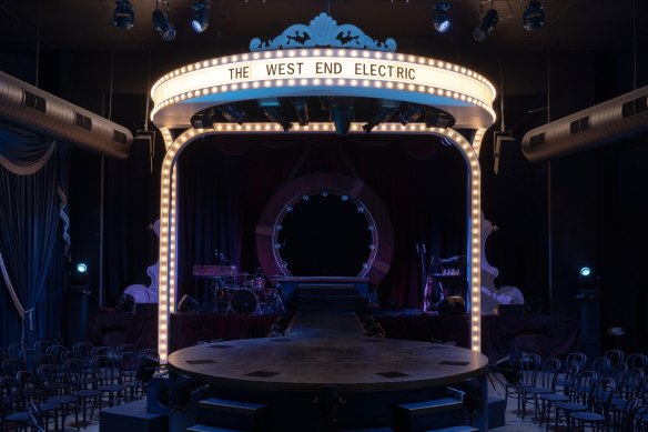 The venue is inspired by European cabaret clubs and features a round thrust stage.