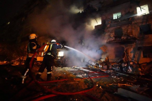 Photos from Ukraine’s Emergency Services department show a multi-storey building burning in southeast Kyiv.
