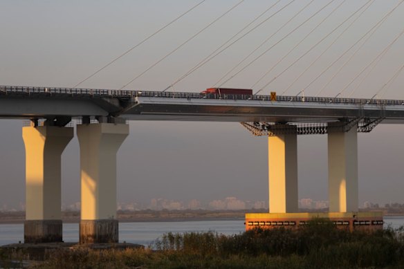 A cargo truck drives over the New Yalu River Bridge towards the Chinese border city of Dandong.
