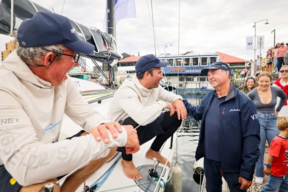 Yann Rigal and Michael Quintin are congratulated by Sam Haynes, the CYCA commodore and last year’s overall winner on Celestial V70