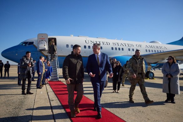 Volodymyr Zelensky, left, touches down in the United States on Thursday, after travelling on a US plane.
