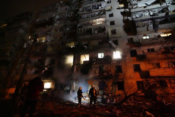 A burning building in Kyiv on February 25 as missiles strike the city.