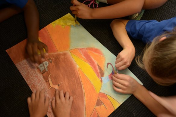Bangerang and non-Indigenous pupils at St Georges Road Primary School in Shepparton animating one of the drawings for the Dunggula digital touch book.