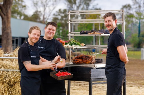 Embers Wood Fire Dining chefs cooking hogget at Towri Growers Market.
