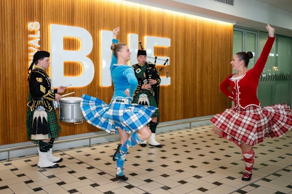 Drum major Alexander Middlemis (left) and Royal Edinburgh Military Tattoo performers at the airport’s Arrivals Hall.
