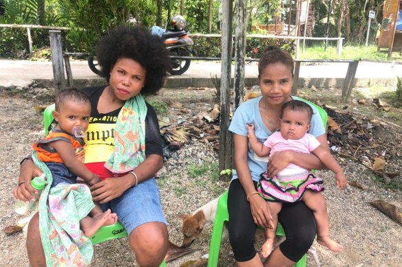 Esterlina and Ella, two of the mothers in Tanjung Kasuari, and their children.