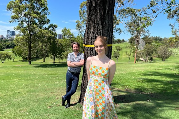 Playwright and actor Amelia Slatter and director Calum Johnston in Victoria Park, where activists have marked trees in yellow to highlight the risks of development. 