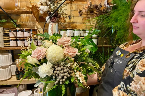 Senior florist Anya Bogatek crafts a bouquet at Stalks and Stems florist shop in Woolloongabba.