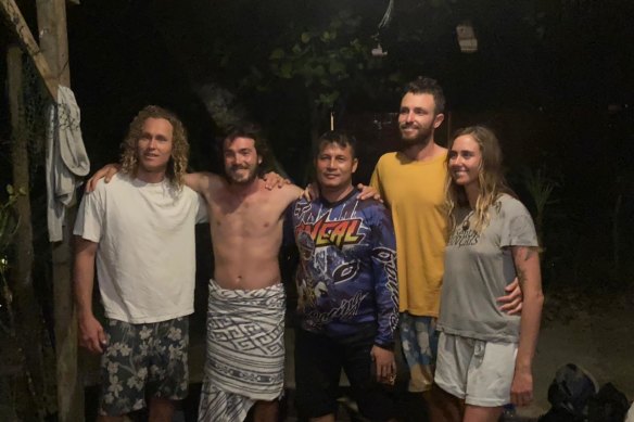 Australians Jordan Short, Will Teagle, Elliot Foote and Steph Weisse with Yustinus Sega, centre, the Indonesian search and rescue officer who found three of them on Tuesday. The fourth, Foote, was picked up by fishermen.