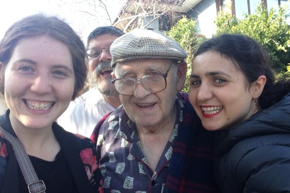 Nomi Kaltmann (left) and her sister with their grandfather Zaida Yossel (centre).
