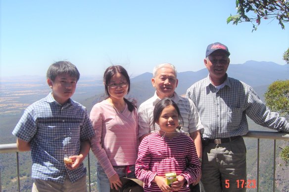 Jasmine Nguyen (at front) with her family in 2006. Her parents first met on a boat fleeing Vietnam in the wake of the war.