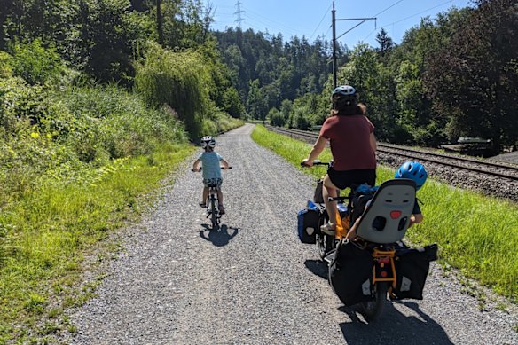 Kim Fisher rides her family’s electric cargo bike at a child’s pace of 15km/h.