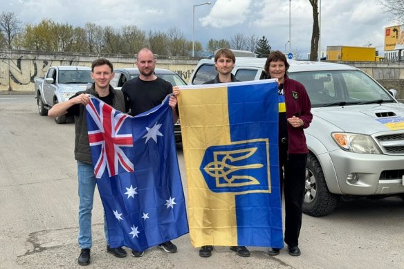 (From left) Ivan from Car For Ukraine with Cooper, Dexter, and Claire Oelrichs in Lviv, Ukraine.