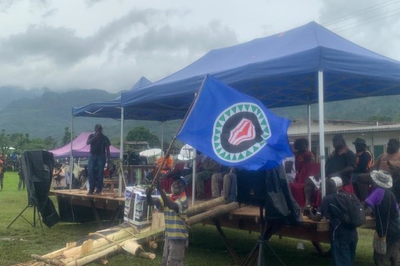 The Bougainville flag, which Marilyn Havini helped design, is waved at a pro-independence rally.