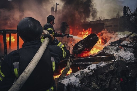 Rescue workers put out a fire of a building which was destroyed by a Russian strike in Brovary, outside Kyiv last week.