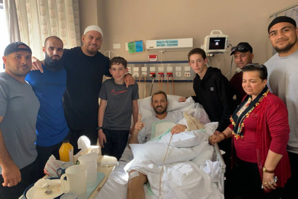 Richmond footballer Bachar Houli (second from left) and New Zealand rugby player Sonny Bill Williams visit victims of the Christchurch massacre in hospital. 