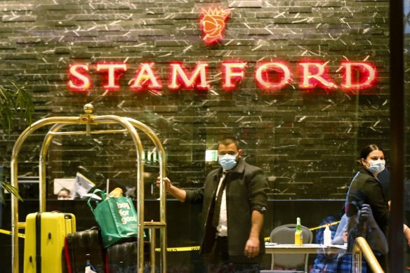 Masked workers inside the Stamford hotel.