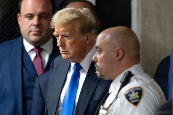 Former US president Donald Trump, centre, after the verdict was read at Manhattan criminal court in New York.