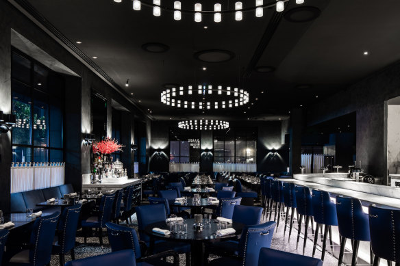 Inside the midnight blue dining room.