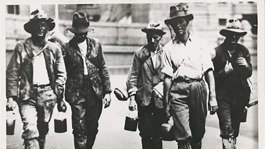 A group of men on the hunt for work during the Great Depression.