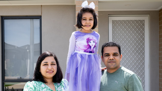 Ashok Kok with wife Monika and five-year-old daughter Eva outside their Manor Lakes home.