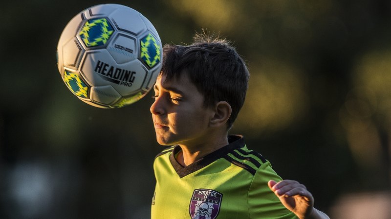 Soccer headers and children: Why kids shouldn't be allowed to hit the ball  with their heads.