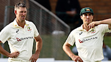 Australia’s Beau Webster (left) and Pat Cummins in conversation on day three.