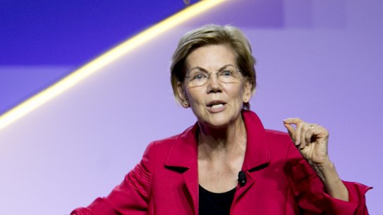 Senator Elizabeth Warren, right, speaks beside CNN political analyst April Ryan at the 110th NAACP Annual Convention in Detroit this week.