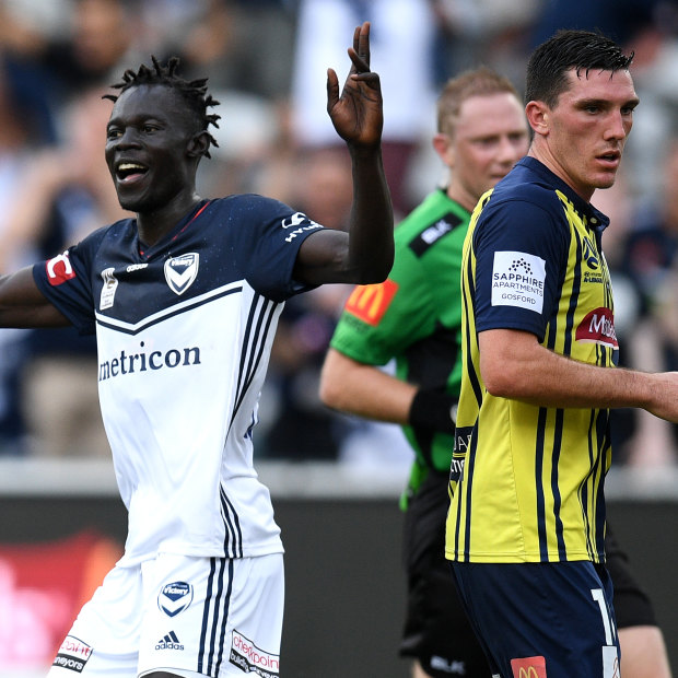 Melbourne Victory's Kenny Athiu (left).